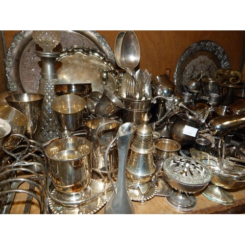 91 - A large quantity of silver plated ware to include carafes, decanters, trays, goblets, coffee spoons ... 