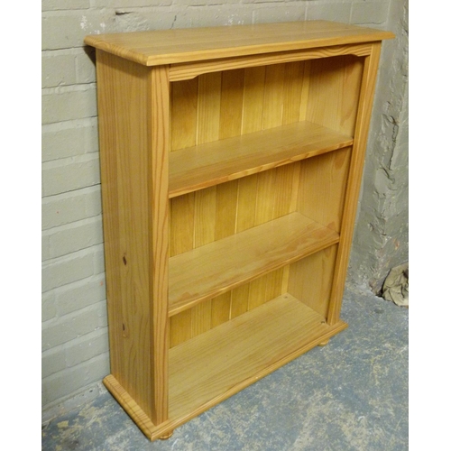 141 - A reproduction pine open bookcase, 83cm wide x 110cm high x 27.5cm deep