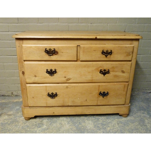 145 - A late 19th/early 20th century pine chest of two short and two long graduated drawers beneath the ro... 