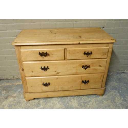 145 - A late 19th/early 20th century pine chest of two short and two long graduated drawers beneath the ro... 