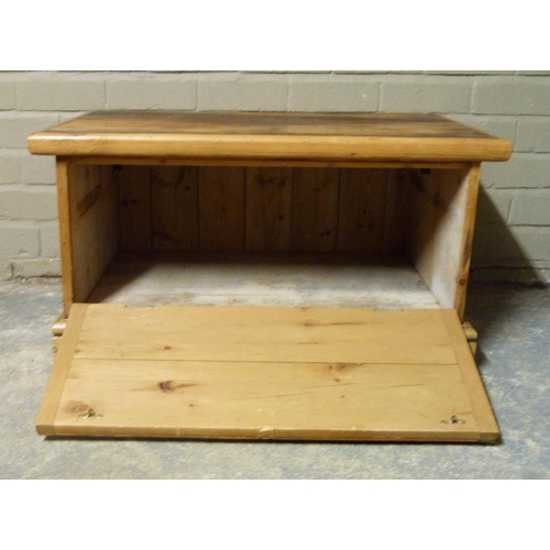 148 - A pine cupboard, rectangular top above a drop down front on skirted plinth, 84cm wide  x 45cm high x... 