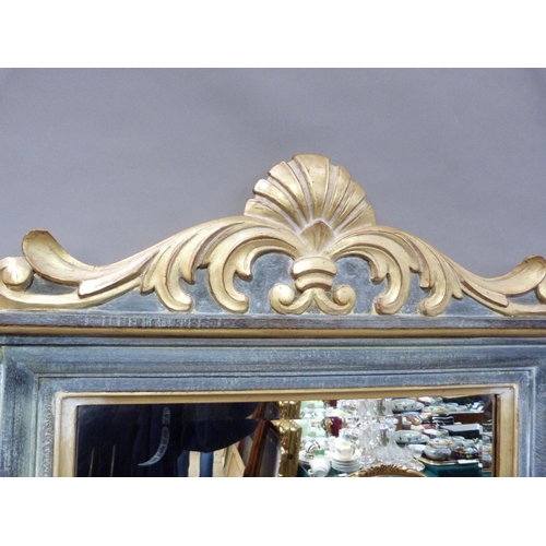 354 - A modern wall mirror in gilt and grey having a shell and foliate scroll pediment and apron, the rect... 