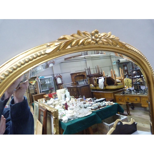 355 - A Victorian style gilt wall mirror, arched profile with foliate cresting and beaded frame, the glas ... 