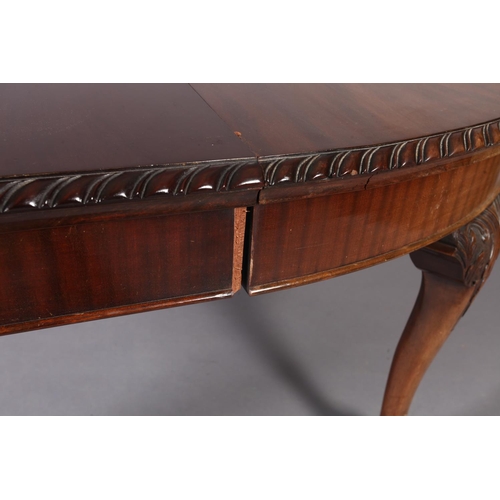 261 - A reproduction extending dining table in George III style, the oval top with gadroon lip above a dee... 