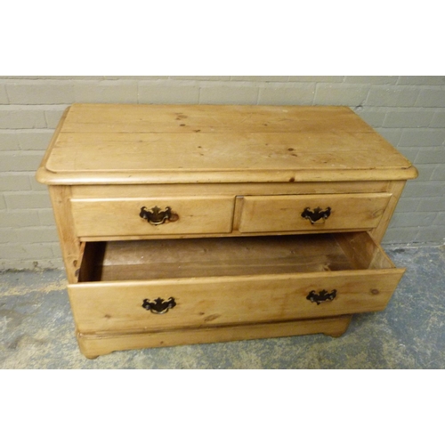 145 - A late 19th/early 20th century pine chest of two short and two long graduated drawers beneath the ro... 