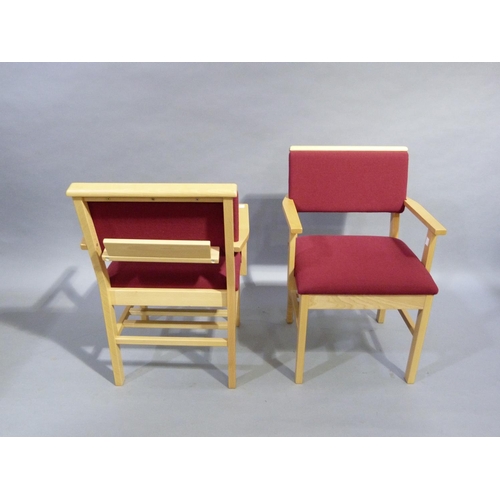 294 - A pair of beech framed carvers upholstered in crimson to the back and seat, each with a bookrest to ... 