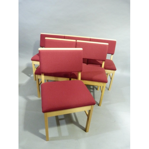 295 - A set of six beech framed single chairs upholstered in crimson to the back and seat, each with a boo... 