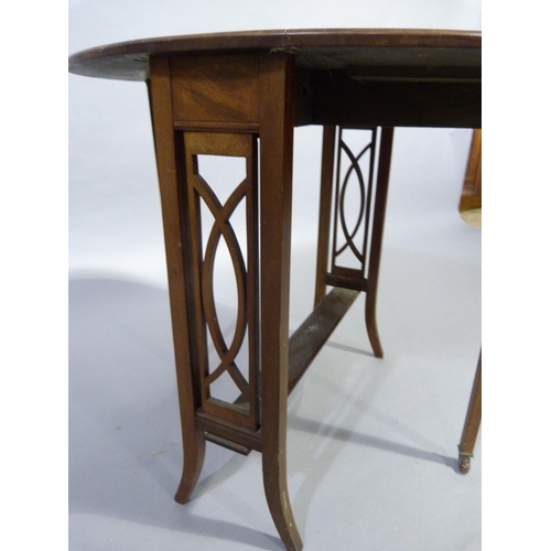 324 - A 1920's mahogany Sutherland table having twin oval drop leaves, refectory supports with pierced rai... 