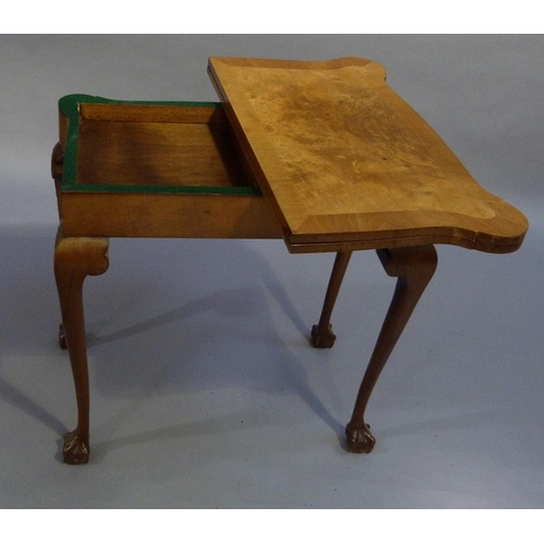 287 - A walnut card table, the rectangular top with serpentine front and rounded corners, cross banded, th... 