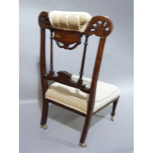 297 - A late Victorian rosewood and ivorine inlaid nursing chair having a partially upholstered top rail a... 