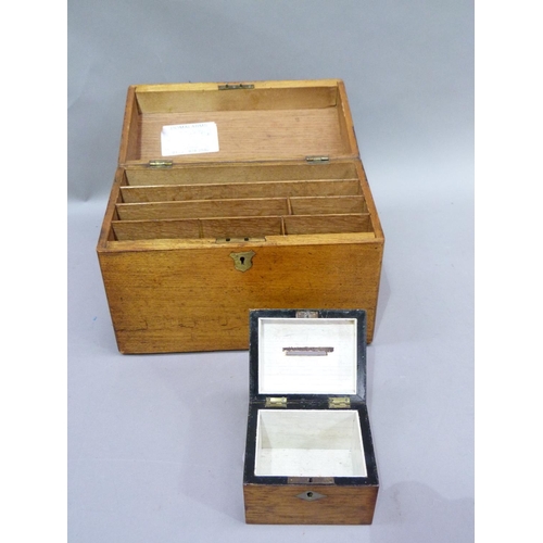 48 - An oak box fitted for stationery to the interior together with a small money box