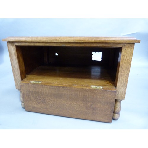 248 - An oak audio cabinet (adapted) having a dummy drawer drop front and on turned legs 62cm W x 42cm D x... 