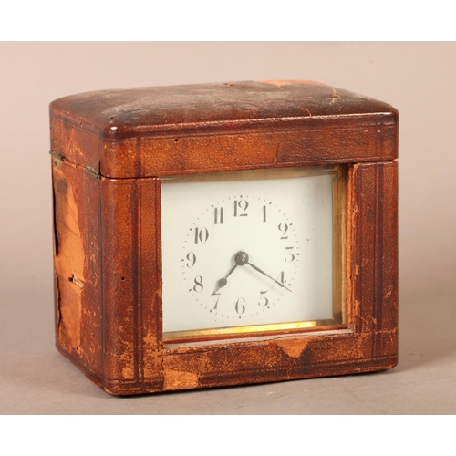 6 - A brass case carriage clock, with swing handle, plain case, white enamel dial with Arabic numerals, ... 