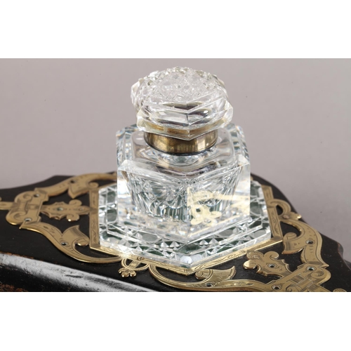 9 - A Victorian ebonised and cut brass strapwork desk standish fitted with a hobnail cut glass inkwell o... 