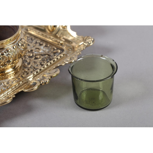 14 - A Victorian brass desk standish fitted with a central inkwell and cover cast with ribboned harebells... 