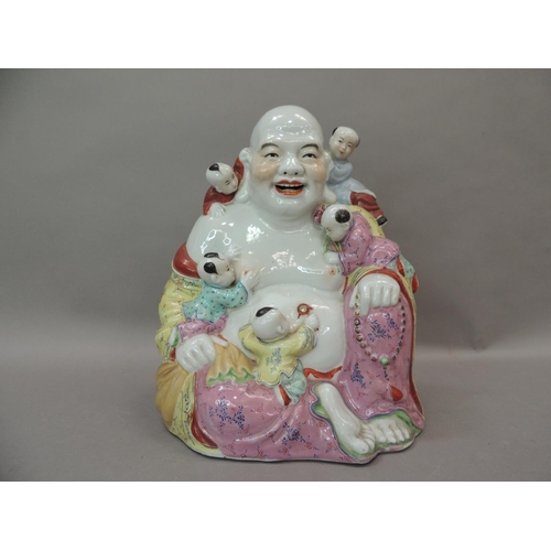 26 - A ceramic figure of Hotei, the buddha with small children climbing over him, 25cm high