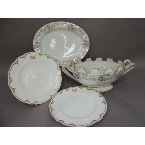 27 - A 19th century porcelain twin handled tureen with crenallated rim raised on an oval foot rim, the bo... 