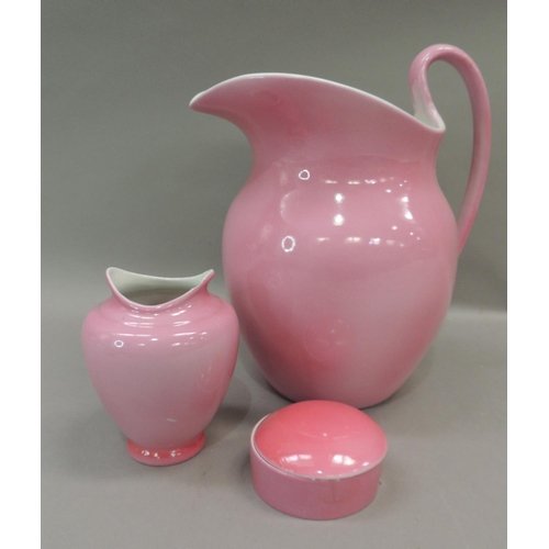 18 - An early 20th century pink glazed toilet jug, vase, soap dish and cover