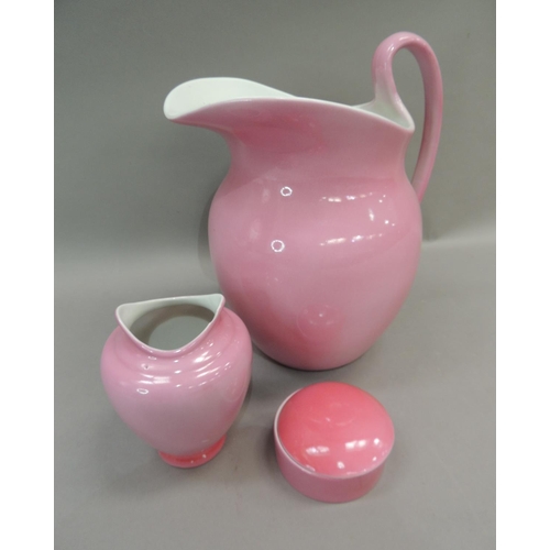 18 - An early 20th century pink glazed toilet jug, vase, soap dish and cover