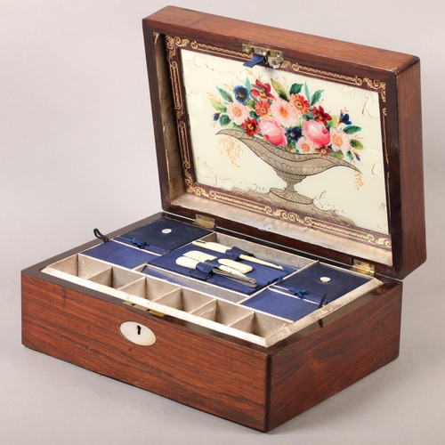 19 - A Victorian rosewood work box inlaid in mother-of-pearl with an oval cartouche and escutcheon, recta... 