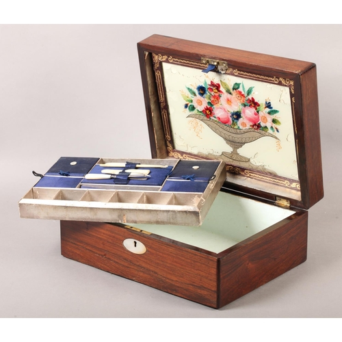 19 - A Victorian rosewood work box inlaid in mother-of-pearl with an oval cartouche and escutcheon, recta... 