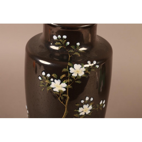 2 - A Chinese vase of tapered form, the dark brown ground, moulded and painted with a prunus tree and wh... 