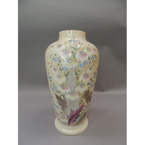 21 - An Edwardian milk glass vase hand painted with sprays of flowers, 33cm high