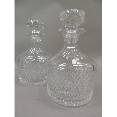 22 - A pair of cut glass decanters and stoppers, 22cm high