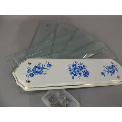 24 - Five vintage bevelled glass door plates with faceted screw heads together with a later blue and whit... 