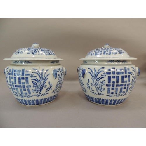 28 - A pair of Chinese blue and white jars and covers decorated with geometric panels with stylised flowe... 