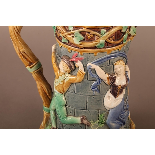3 - A Minton towered jug, with pewter mounted lid with jester finial, the body relief moulded with medie... 