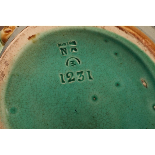 3 - A Minton towered jug, with pewter mounted lid with jester finial, the body relief moulded with medie... 