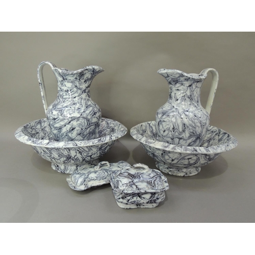 30 - A Victorian six piece toilet set of grey marbled decoration comprising two water jugs, two bowls on ... 