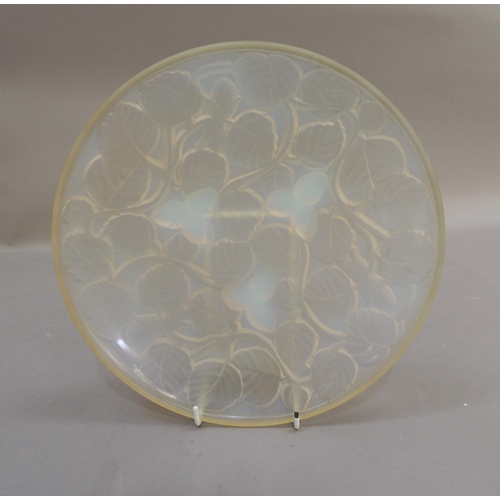 38 - An Arxere opalescent glass circular bowl, the reverse moulded in relief with leaves and hazelnuts, 2... 