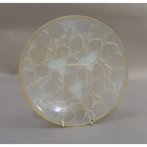 38 - An Arxere opalescent glass circular bowl, the reverse moulded in relief with leaves and hazelnuts, 2... 