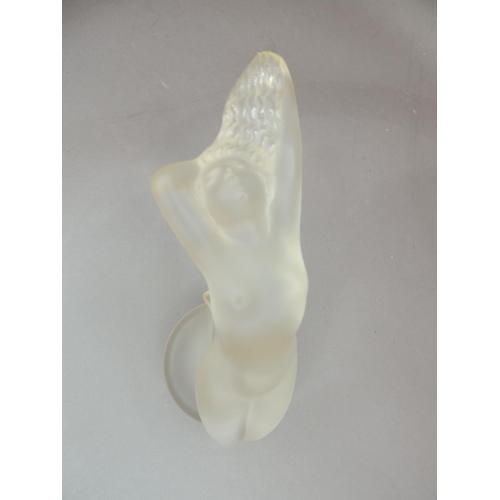 39 - A Lalique figure of a reclining naked woman, circular base, engraved signature, 13cm high approximat... 