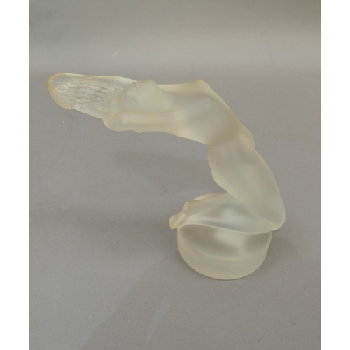 39 - A Lalique figure of a reclining naked woman, circular base, engraved signature, 13cm high approximat... 