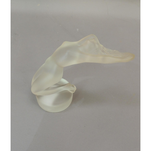 39 - A Lalique figure of a reclining naked woman, circular base, engraved signature, 13cm high approximat... 