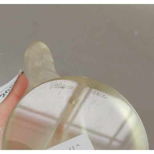 39 - A Lalique figure of a reclining naked woman, circular base, engraved signature, 13cm high approximat... 