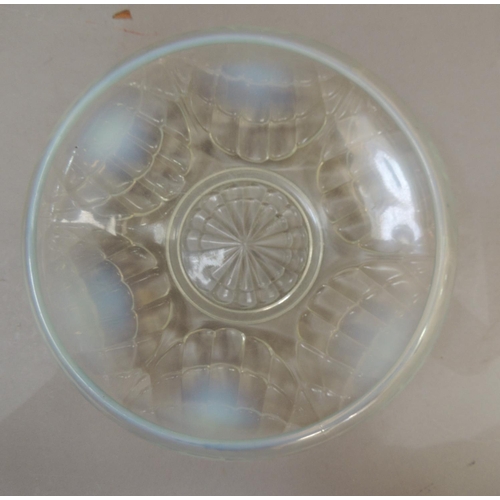 42 - An English opalescent glass bowl, moulded in relief with stylised shells, 20cm diameter, indistinct ... 