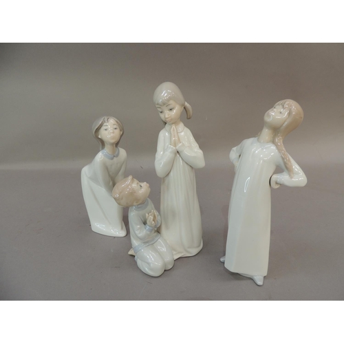 44 - Three Lladro porcelain figures of children in night clothes, 22.5cm and smaller
