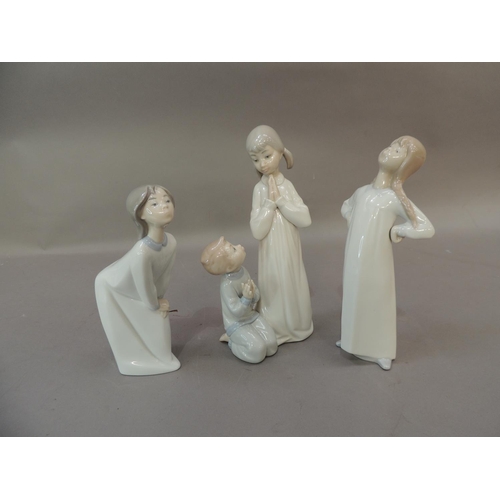 44 - Three Lladro porcelain figures of children in night clothes, 22.5cm and smaller