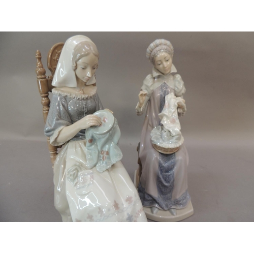 46 - A pair of Lladro porcelain figures of seated females both sewing, 28cm high approximately