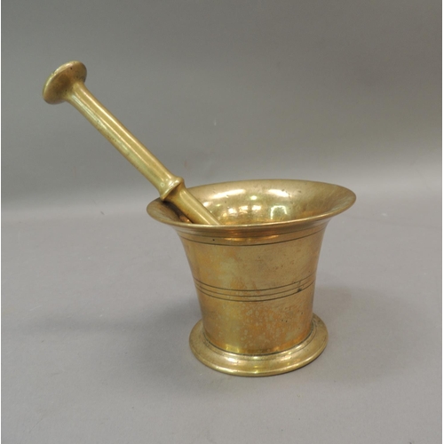 56 - An antique bronze pestle and mortar, tapered cylindrical form with reeded bands, mortar 8.5cm high, ... 