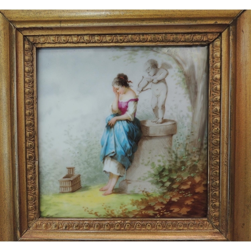 58 - A continental square panel painted with a young woman standing before a pillar with cupid and his bo... 