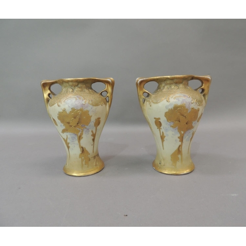 8 - A pair of Amphora two handled vases gilt with poppies and other flowers, 14cm