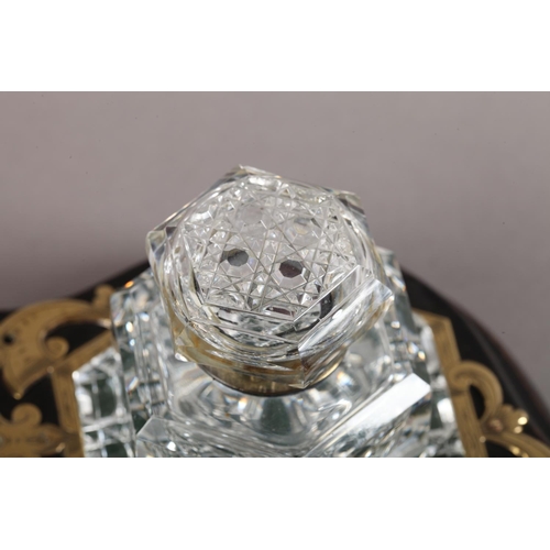9 - A Victorian ebonised and cut brass strapwork desk standish fitted with a hobnail cut glass inkwell o... 