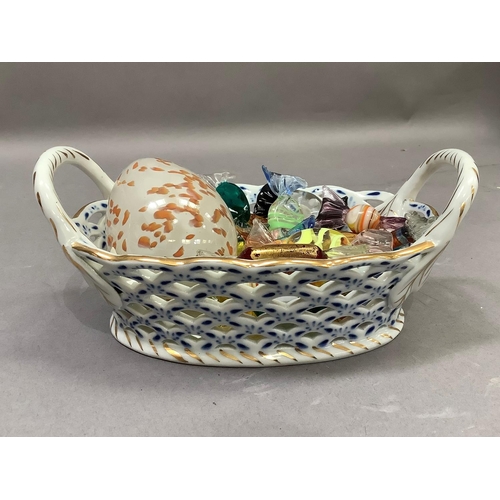 12 - A collection of seventeen Murano glass 'sweets' held in a blue and white china two handled basket of... 