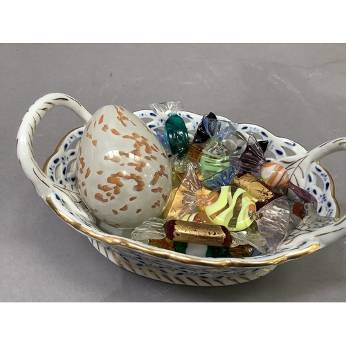12 - A collection of seventeen Murano glass 'sweets' held in a blue and white china two handled basket of... 