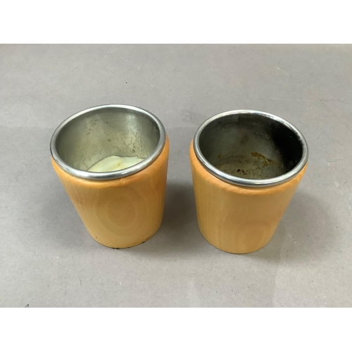 6 - A pair of Linley beech and metal lined candle holders, stamped to the base Linley, 10cm high